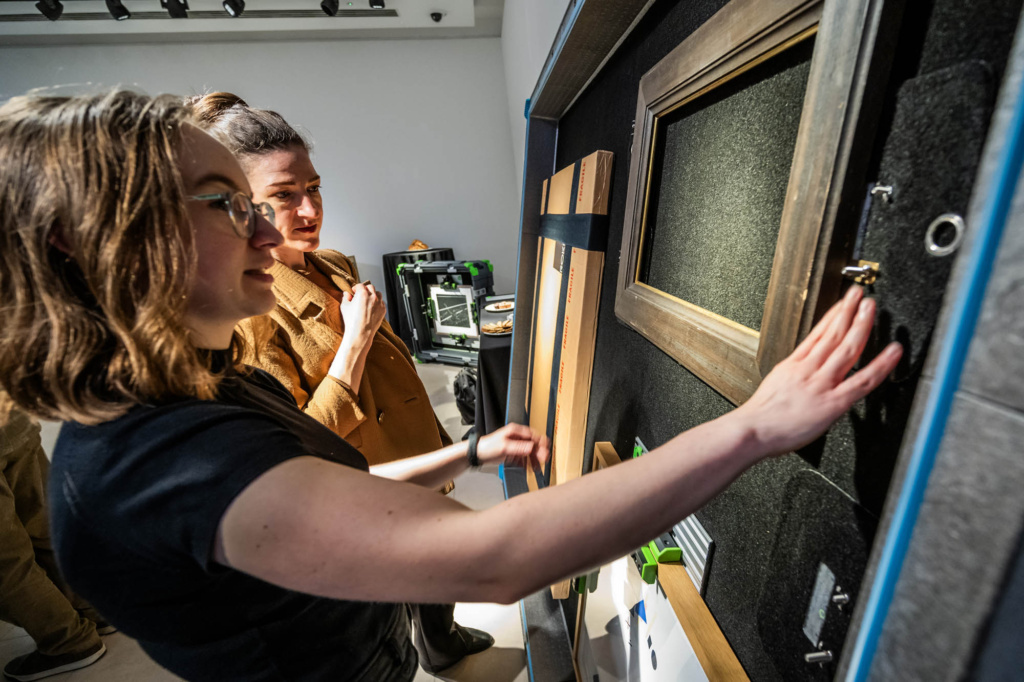 Person demonstrates ROKBOX reusable crates at the Sustainable Industry Showcase, part of GCC Art+Climate Week 2025