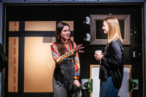 People talking in front of a ROKBOX LiteHD at the Sustainable industry Showcase at Christie's. Credit: Guy Bell